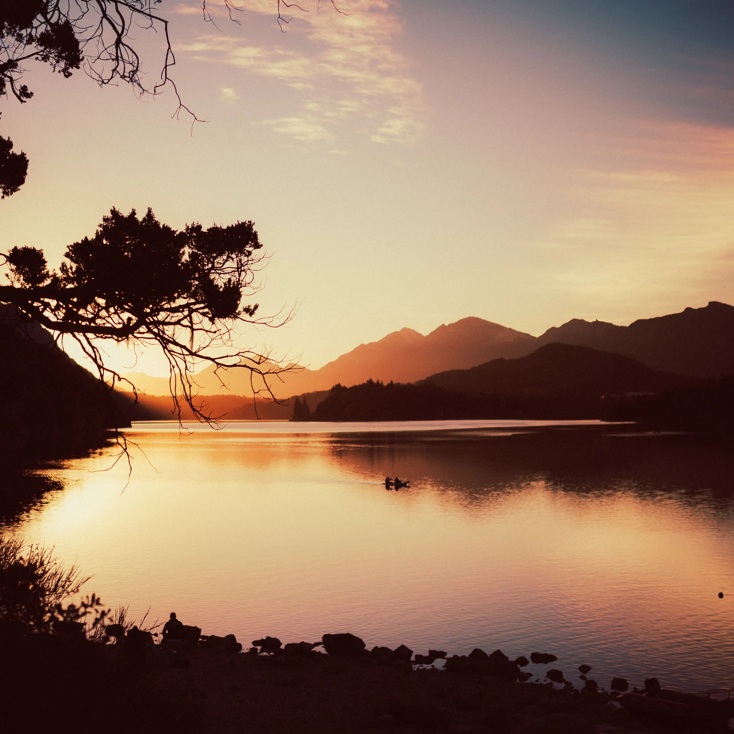 Mountain lake at sunset with colorful sky